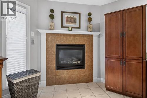 68 Bermondsey Rise Nw, Calgary, AB - Indoor Photo Showing Living Room With Fireplace