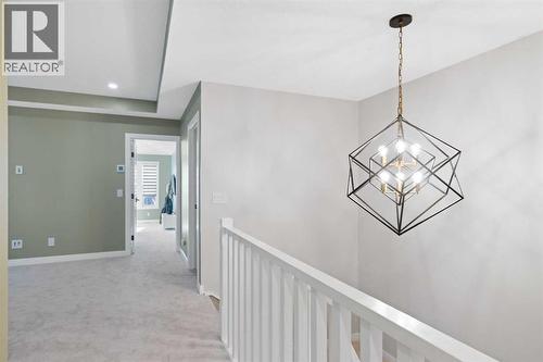 96 Emberside Glen, Cochrane, AB - Indoor Photo Showing Other Room