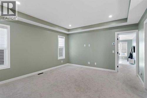 96 Emberside Glen, Cochrane, AB - Indoor Photo Showing Other Room