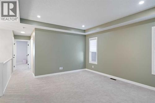 96 Emberside Glen, Cochrane, AB - Indoor Photo Showing Other Room
