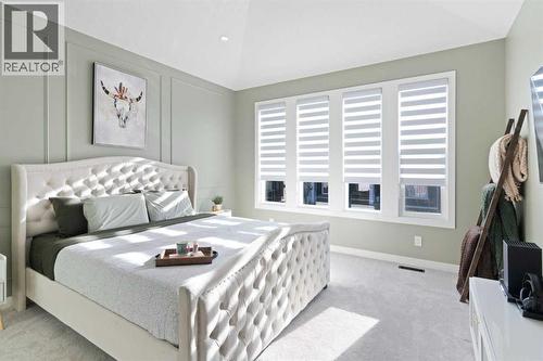 96 Emberside Glen, Cochrane, AB - Indoor Photo Showing Bedroom