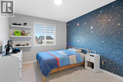 96 Emberside Glen, Cochrane, AB - Indoor Photo Showing Bedroom