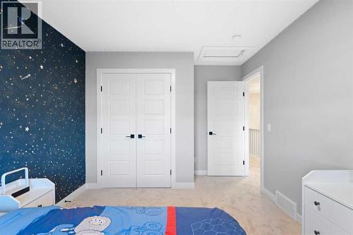 96 Emberside Glen, Cochrane, AB - Indoor Photo Showing Bedroom