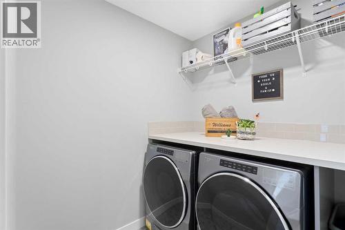 96 Emberside Glen, Cochrane, AB - Indoor Photo Showing Laundry Room