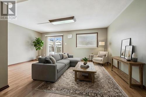 Virtually Staged - 49 - 900 Central Park Drive, Brampton (Northgate), ON - Indoor Photo Showing Living Room
