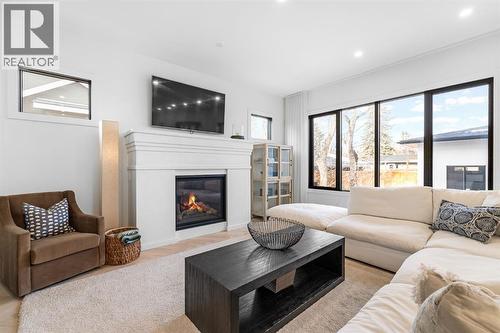 1604 48 Avenue Sw, Calgary, AB - Indoor Photo Showing Living Room With Fireplace