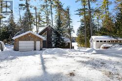 Detached garage has two 240V outlets & workbench - 