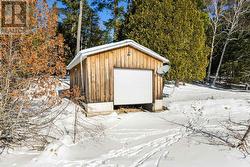 Auto garage door opener for boathouse - 