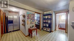 Door to left of fridge leads to a 457 sf unfinished space waiting for your vision! - 