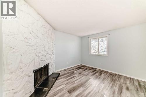 151F Pinehill Road Ne, Calgary, AB - Indoor Photo Showing Other Room With Fireplace