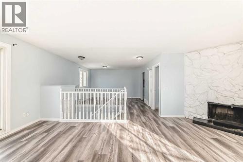 151F Pinehill Road Ne, Calgary, AB - Indoor Photo Showing Other Room With Fireplace