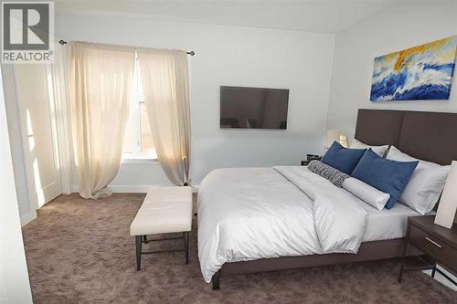 Primary - Virtually Staged - 62 Walden Lane Se, Calgary, AB - Indoor Photo Showing Bedroom