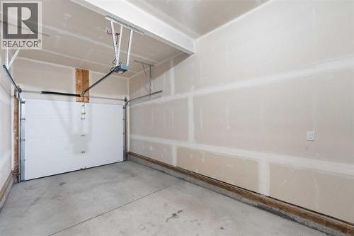 62 Walden Lane Se, Calgary, AB - Indoor Photo Showing Garage
