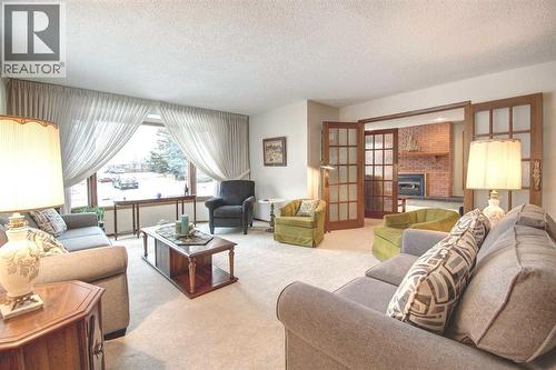 487 Arlington Drive Se, Calgary, AB - Indoor Photo Showing Living Room With Fireplace