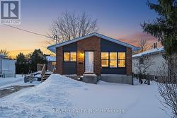 Showing the new siding and large windows - 