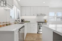 Kitchen with gas stove and soft close cupboards - 