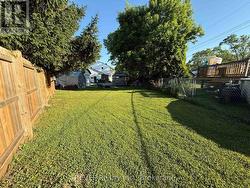 Yard section past pool, gazebo and sheds - 