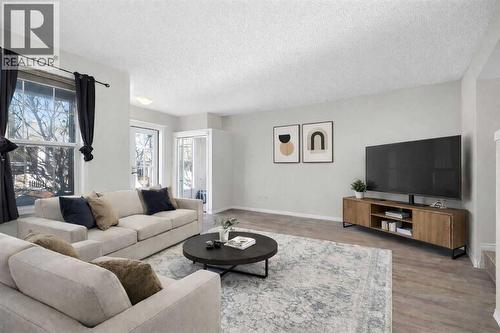 37 Auburn Bay View Se, Calgary, AB - Indoor Photo Showing Living Room
