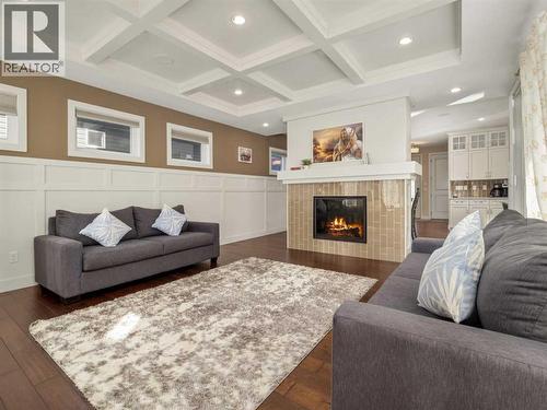 18 Northlander Road W, Lethbridge, AB - Indoor Photo Showing Living Room With Fireplace