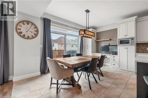 Dining space featuring light tile patterned flooring and baseboards - 346 Moorlands Crescent, Kitchener, ON - Indoor Photo Showing Dining Room