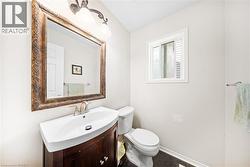 Bathroom featuring vanity and tile patterned flooring - 