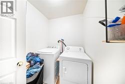 Washroom with washing machine and clothes dryer - 
