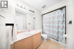 Full bathroom with vanity and shower / bath combo with shower curtain - 