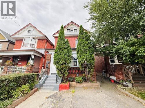 Victorian house featuring brick siding and a porch - 24 Somerset Avenue, Hamilton, ON - Outdoor