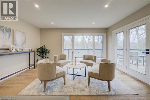 Living area featuring light wood-type flooring and recessed lighting - 279 Ferndale Place, Waterloo, ON - Indoor Photo Showing Living Room
