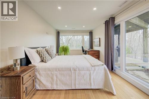 Bedroom featuring light wood finished floors, access to exterior, and recessed lighting - 279 Ferndale Place, Waterloo, ON - Indoor Photo Showing Bedroom