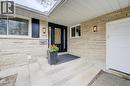 View of exterior entry with a porch, a garage, and brick siding - 279 Ferndale Place, Waterloo, ON  - Outdoor With Exterior 