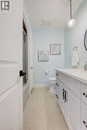 Bathroom with vanity and shower / bath combination with glass door - 