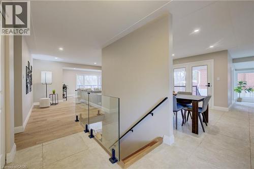Hall with an upstairs landing, recessed lighting, and light tile patterned floors - 279 Ferndale Place, Waterloo, ON - Indoor