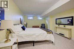 Bedroom featuring light carpet - 