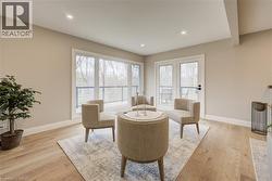 Sitting room featuring light wood finished floors and recessed lighting - 