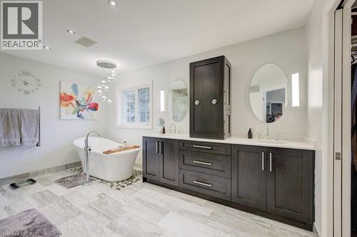 Bathroom featuring double vanity, a soaking tub, and recessed lighting - 1525 Dickie Settlement Road, Cambridge, ON - Indoor Photo Showing Bathroom