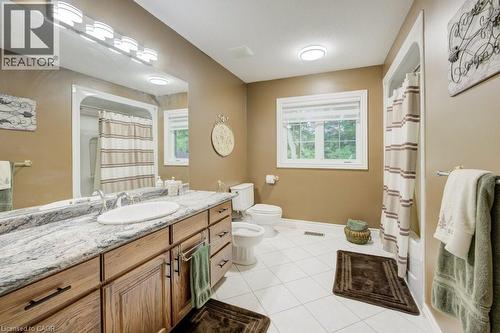 Full bathroom featuring a bidet, vanity, tile patterned flooring, and a shower with curtain - 1525 Dickie Settlement Road, Cambridge, ON - Indoor Photo Showing Bathroom