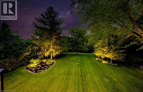 View of grassy yard featuring a fire pit - 1525 Dickie Settlement Road, Cambridge, ON - Outdoor