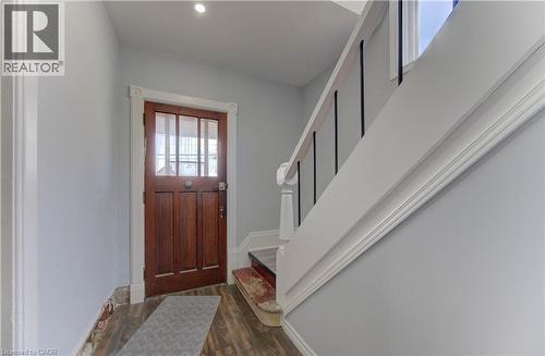 Entryway with wood finished floors, stairway, and recessed lighting - 138 Courtland Avenue E, Kitchener, ON 