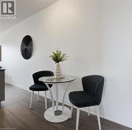 Dining space featuring baseboards and dark wood-type flooring - 