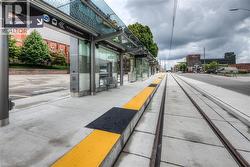 View of road with sidewalks, curbs, and street lights - 