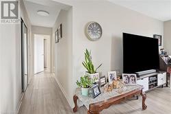 Hall with wood finished floors and baseboards - 