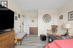 Bedroom featuring light wood finished floors - 
