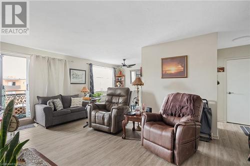 Living area with light wood-style floors and ceiling fan - 485 Thorold Road Unit# 323, Welland, ON - Indoor Photo Showing Living Room