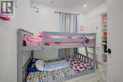 Bedroom with light wood-type flooring and recessed lighting - 