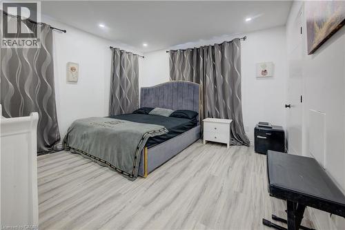 Bedroom with wood finished floors and recessed lighting - 31 Bonfair Court, Kitchener, ON - Indoor Photo Showing Bedroom