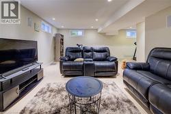 Living room featuring recessed lighting and plenty of natural light - 