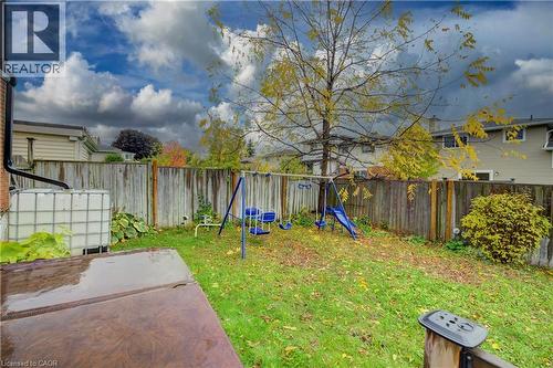 Fenced backyard featuring a playground - 31 Bonfair Court, Kitchener, ON - Outdoor