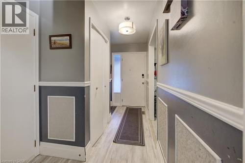 Corridor featuring light wood-type flooring - 31 Bonfair Court, Kitchener, ON - Indoor Photo Showing Other Room
