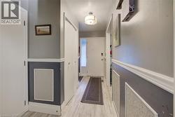 Corridor featuring light wood-type flooring - 